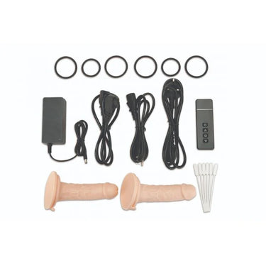 Components of the sex machine laid out, including two dildos, a wireless controller, power supply, and supporting accessories for an enhanced experience.